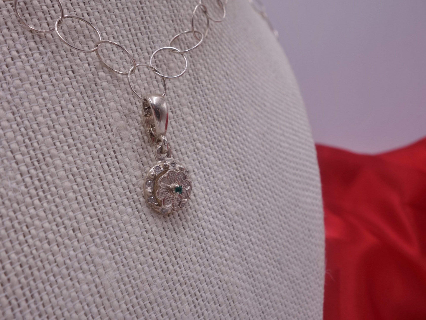 Rotating Silver Flower with Green Emerald Center with Diamonds