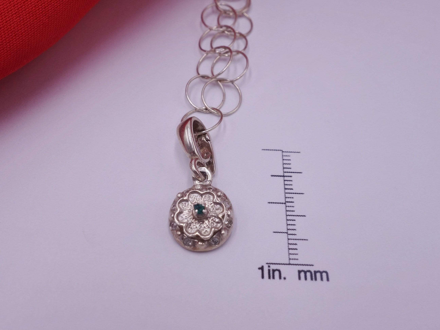 Rotating Silver Flower with Green Emerald Center with Diamonds