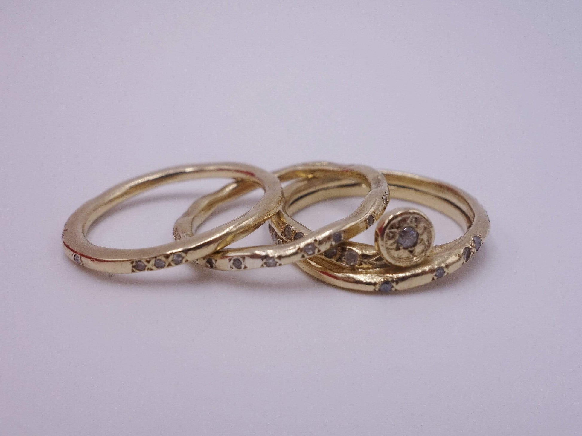 Intertwined Gold Rings with Diamonds