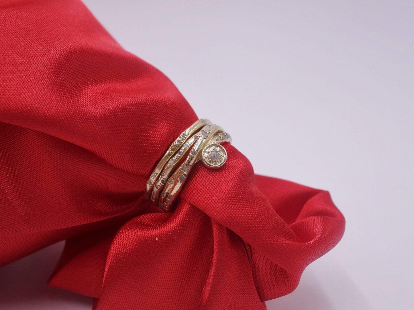 Intertwined Gold Rings with Diamonds