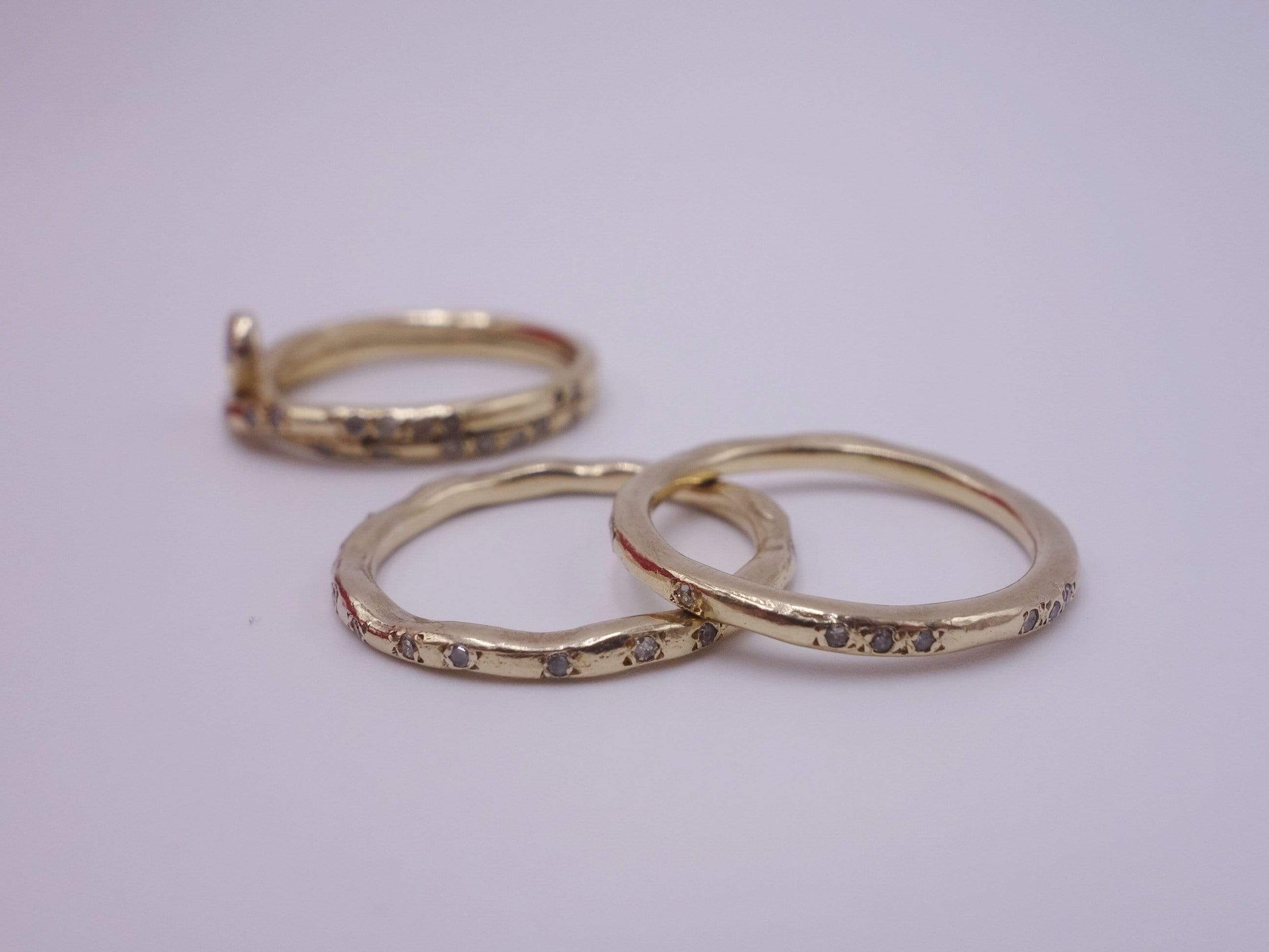 Intertwined Gold Rings with Diamonds