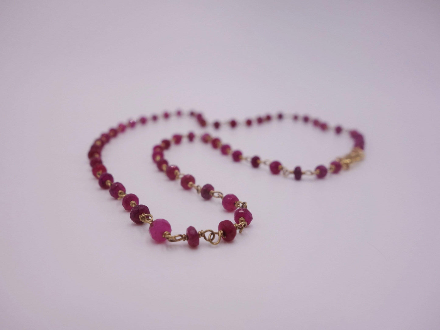 Ruby necklace wrapped with 18kt gold