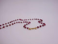 Ruby necklace wrapped with 18kt gold