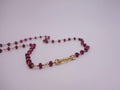 Ruby necklace wrapped with 18kt gold
