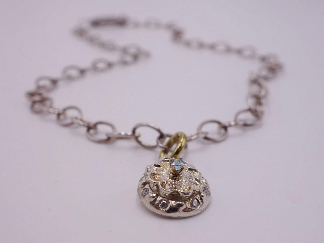 Silver Flower with Blue Topaz Center with Diamonds