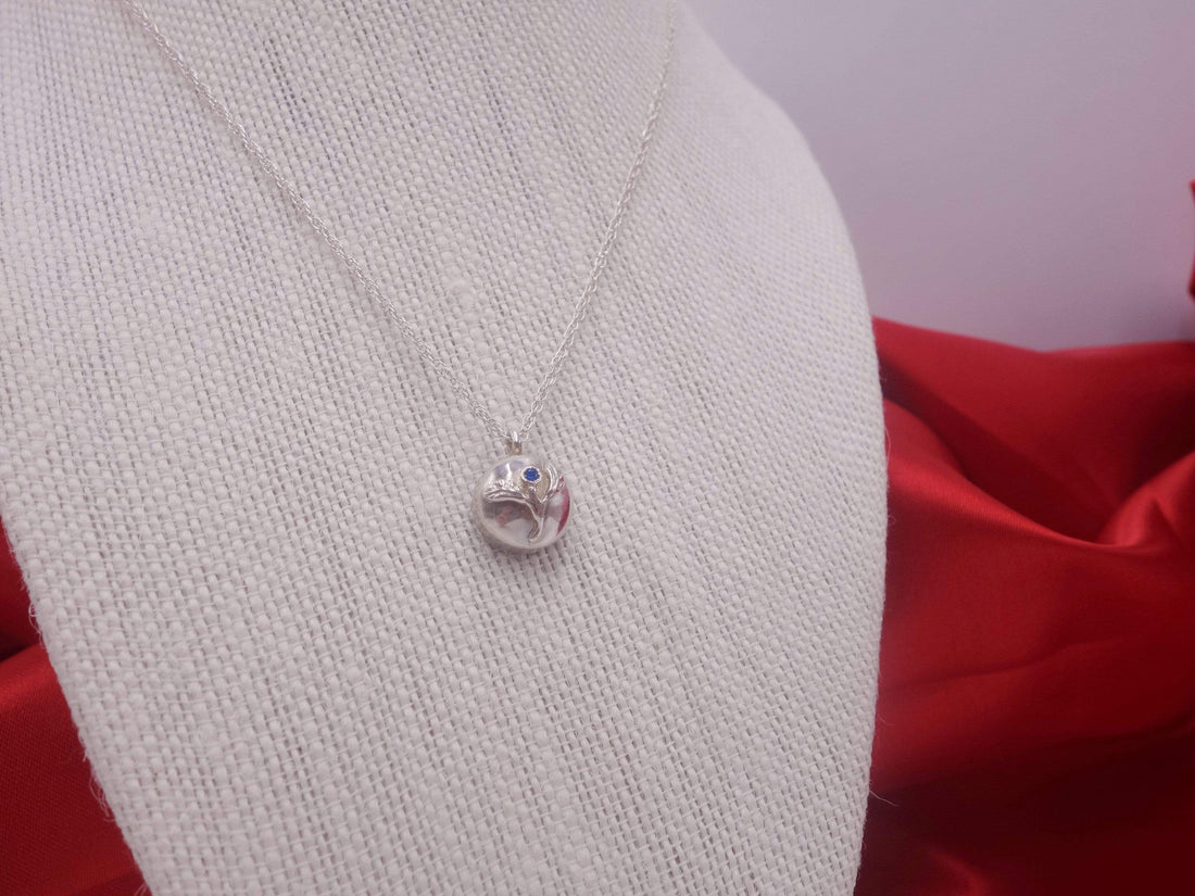 Delicate Silver Flower Pendant with Blue Sapphire