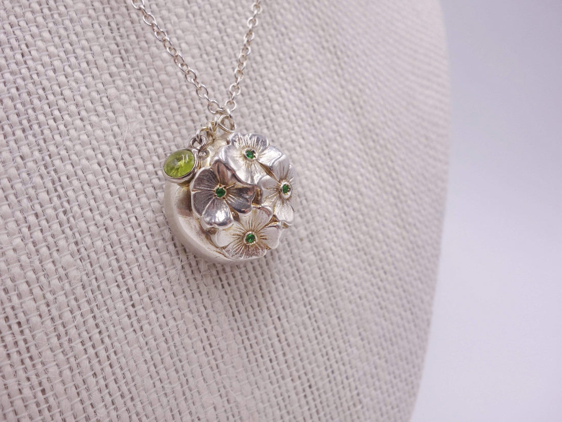Silver dome pendant with emerald