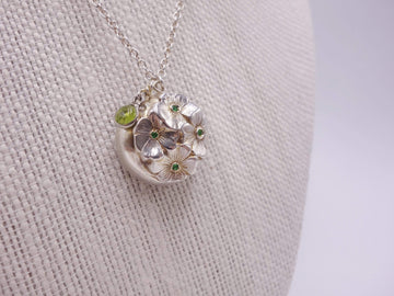 Silver dome pendant with emerald