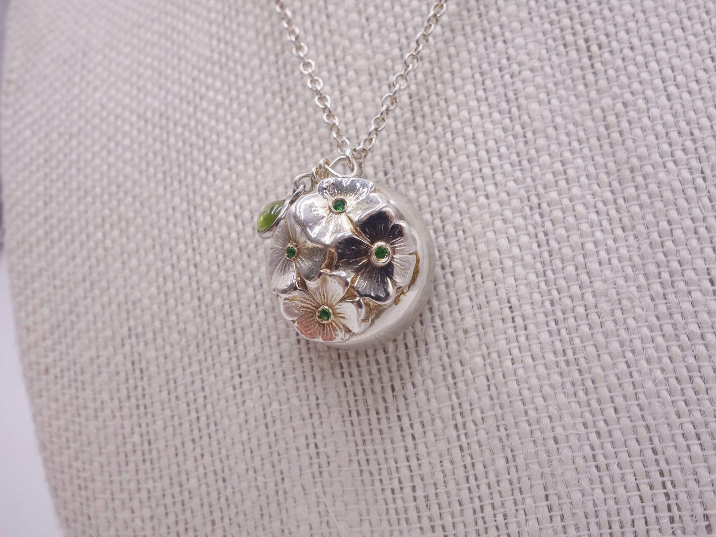 Silver dome pendant with emerald