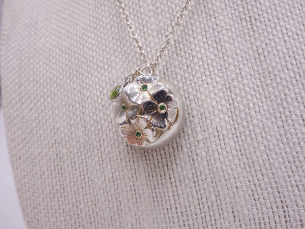 Silver dome pendant with emerald
