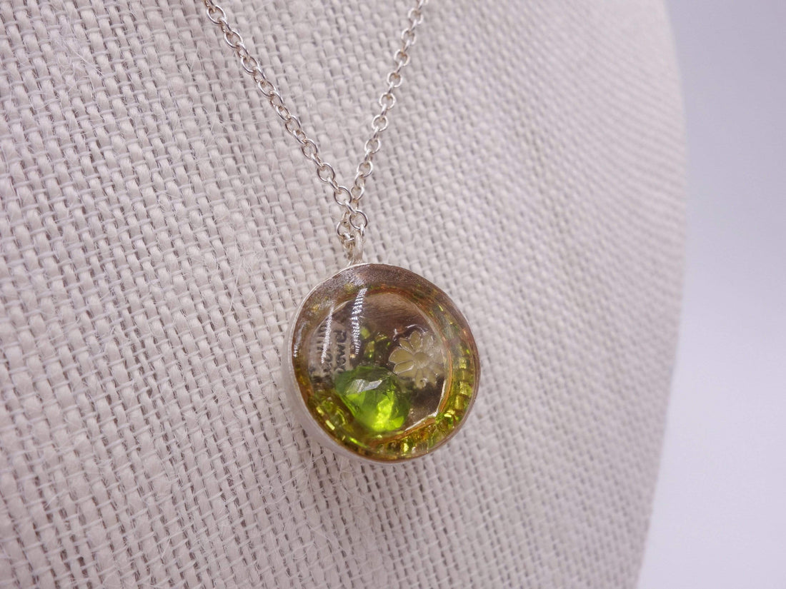 Silver dome pendant with emerald