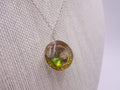 Silver dome pendant with emerald