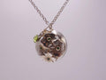 Silver dome pendant with emerald