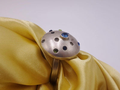 Domed silver ring with precious and semi precious stones