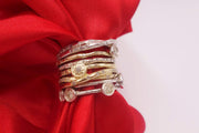 Seven Stackable Gold and Silver Rings