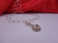 Rotating Silver Flower with Green Emerald Center with Diamonds