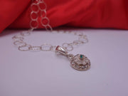 Rotating Silver Flower with Green Emerald Center with Diamonds