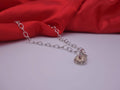 Rotating Silver Flower with Pink Topaz Center with Diamonds