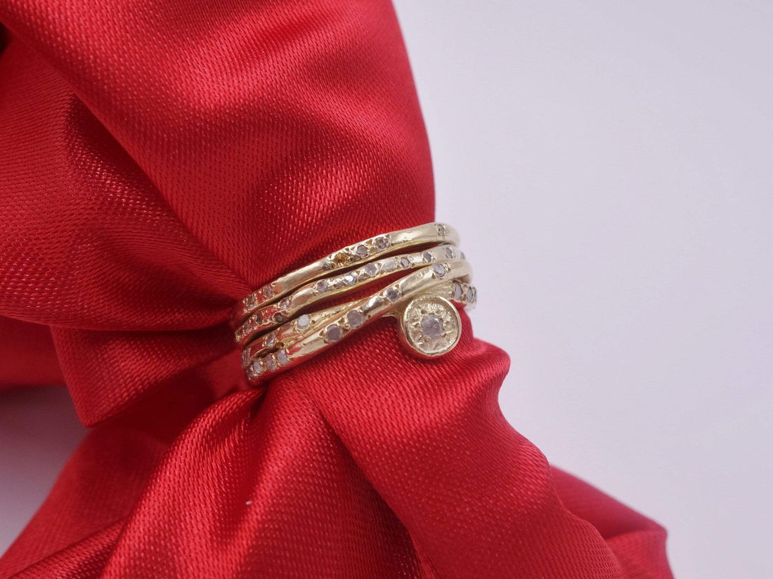 Intertwined Gold Rings with Diamonds