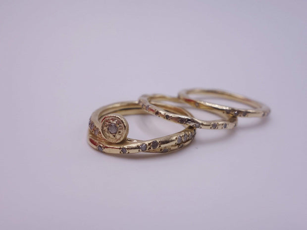 Intertwined Gold Rings with Diamonds