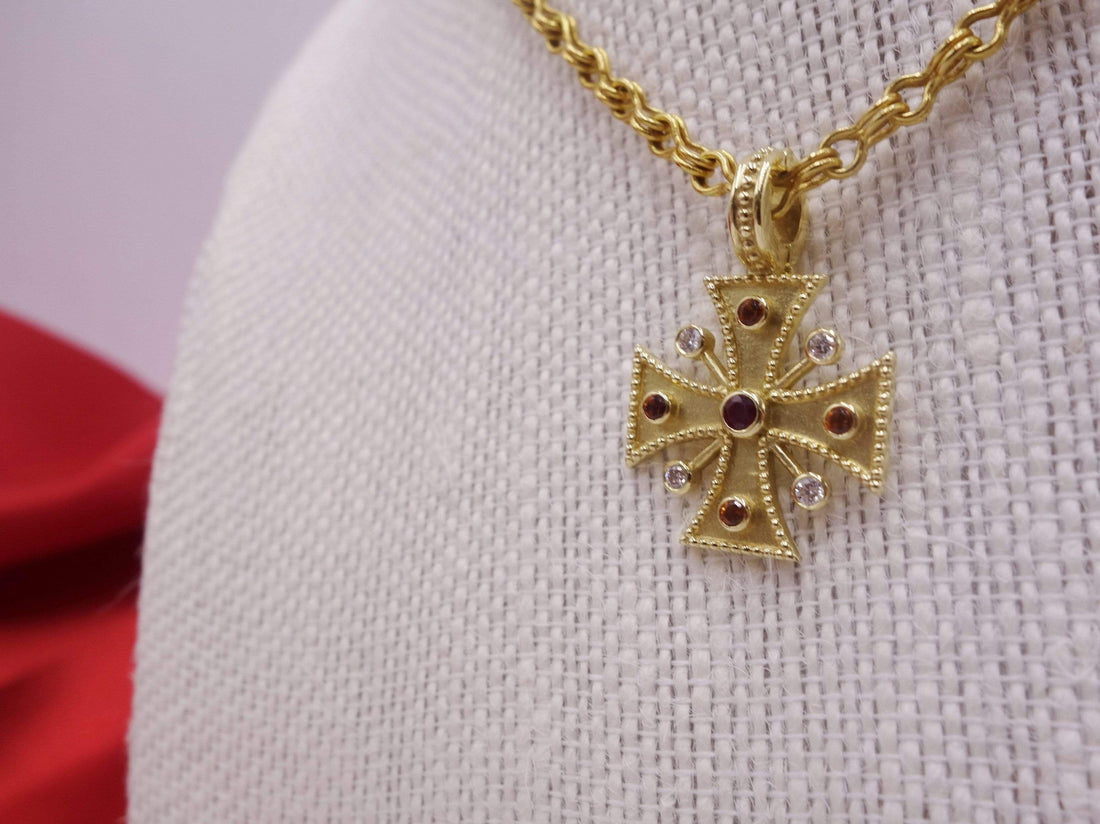 Gold Cross necklace pendant with diamonds, sapphires and a ruby