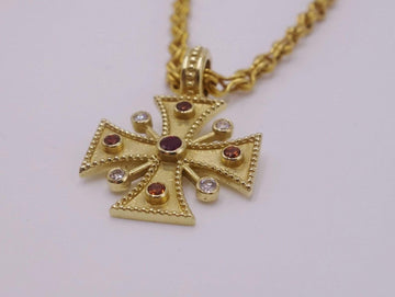 Gold Cross necklace pendant with diamonds, sapphires and a ruby